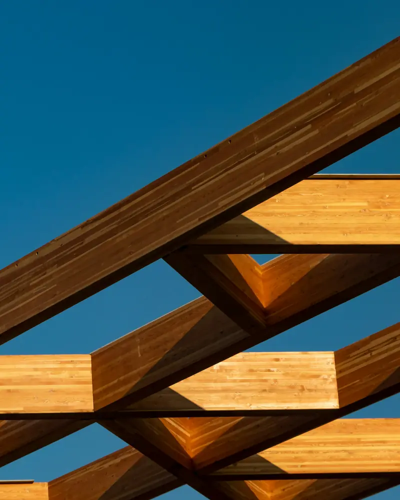 Close-up of timber beams joined in a structural frame