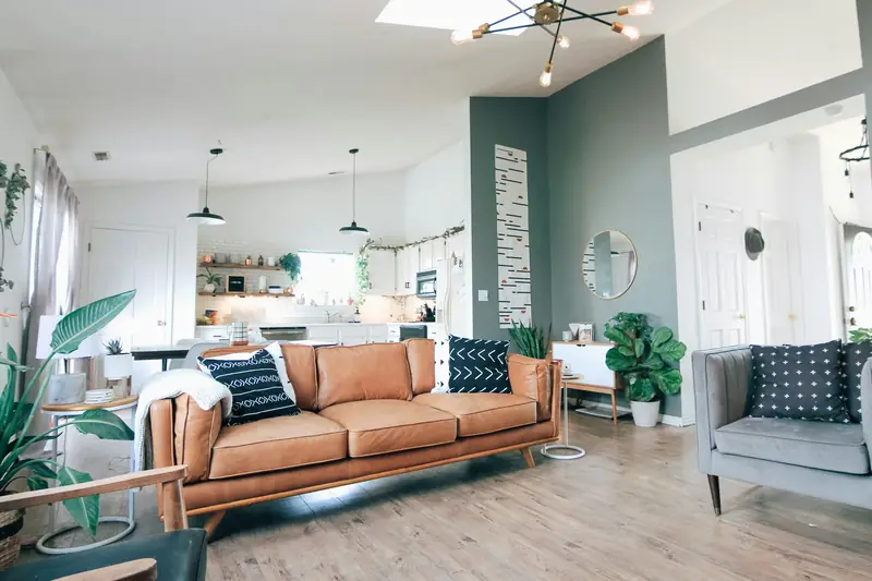 Bright, open living room with wood floors after a remodel
